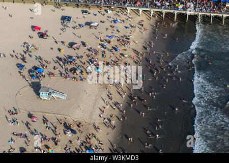 Santa Monica, California, USA - August 6, 2016:  Aerial view of summer crowds at popular Santa Monica beach and pier near Los Angeles. Stock Photo