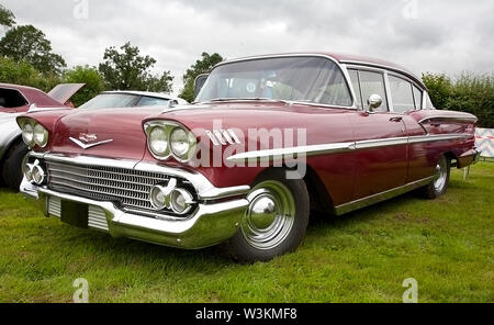 A red Chevrolet Impala automobile on show at a classic car show in Wales, UK Stock Photo