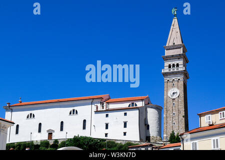 Low angle view of St George's Church and bell tower in Piran, Slovenia Stock Photo
