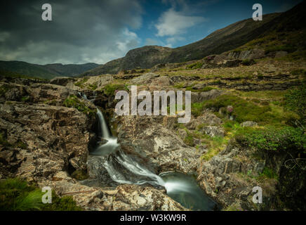 this image was taken in July of the waterfall on the Watkins path, leading to the mountain of snowdon, snowdonia, north Wales, United Kingdom Stock Photo