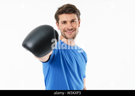 Handsome smiling young fit sportsman standing isolated over white background, boxing Stock Photo