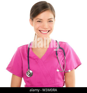 Nurse. Portrait on young woman nurse / medical student in her 20s wearing pink scrubs and stethoscope. Isolated on white background. Mixed Asian / Caucasian model. Stock Photo