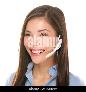 Headset customer service woman talking friendly smiling happy in call center on isolated on white background. Beautiful young mixed race Caucasian / Asian Chinese business woman working at hotline. Stock Photo