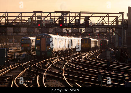 Southern GTR and South Eastern trains arrive and depart from a crowded London Bridge station during the morning rush hour Stock Photo