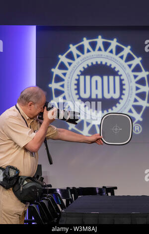 Auburn Hills, Michigan - Photographer Jeff Kowalski checks his camera's exposure and color balance before the ceremonial opening of contract negotiati Stock Photo
