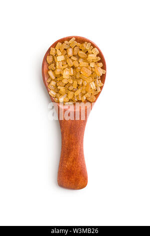 Crystalized brown sugar in spoon isolated on white background. Stock Photo