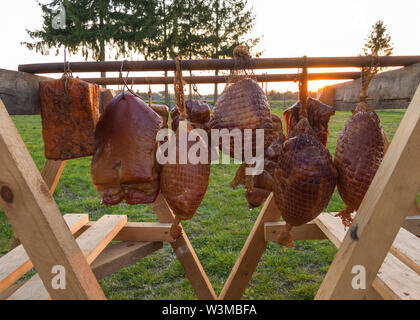 homemade smoked various meat drying after smoking process Stock Photo