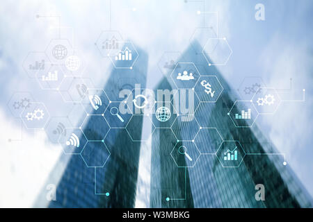 Double exposure mixed media. Diagrams and icons on hologram screen. Business people and modern city on background Stock Photo