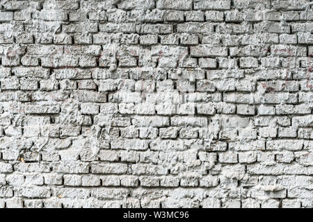Mortar sprayed brick wall background, old house facade texture Stock Photo