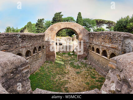 Immersive panoramic view of an ancient Roman graves with columbarium architecture with many cinerary urns, the tomb it's located in the archaeological Stock Photo