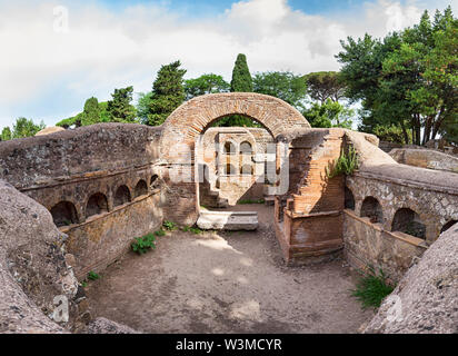 Giant immersive panoramic view of an ancient Roman graves with columbarium architecture with many cinerary urns, the tomb it's located in the archaeol Stock Photo