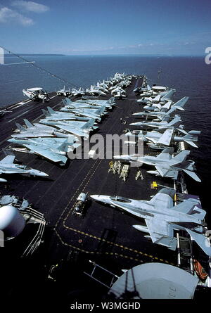 AJAXNETPHOTO. SPITHEAD, ENGLAND. - BIG E - USS ENTERPRISE FLIGHT DECK - THE HUGE FLIGHT DECK OF ONE OF THE WORLD'S LARGEST AIRCRAFT CARRIERS, USS ENTERPRISE, COVERED WITH PARKED TOMCAT FIGHTER AND SURVEILLANCE AIRCRAFT.  PHOTO:JONATHAN EASTLAND/AJAX.  REF:212071 99 Stock Photo