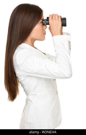 Side view of young businesswoman looking through binoculars isolated over white background Stock Photo