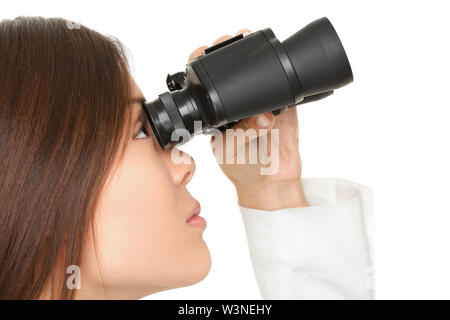Closeup of young businesswoman looking through binoculars over white background Stock Photo