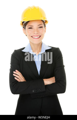 Portrait of confident young female architect standing arms crossed isolated over white background Stock Photo