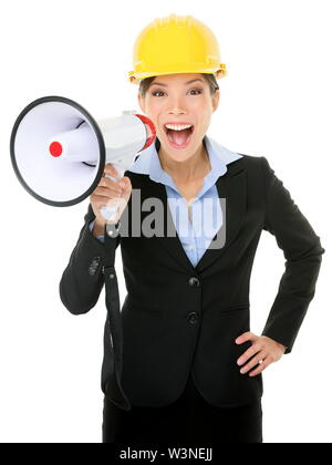 Portrait of young businesswoman shouting into megaphone isolated on white background Stock Photo