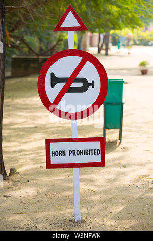 traffic sign indicating the prohibition of using the vehicle horn No horn, trumpet prohibition sign Board. Stock Photo