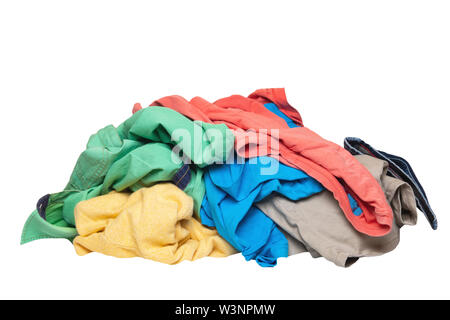 Pile of clothes isolated. Stack of colorful dirty clothes ready for the laundry isolated on a white background. Stock Photo