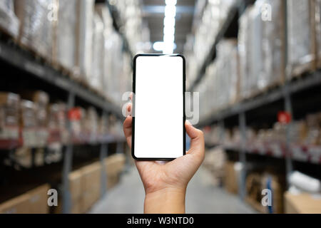 Mockup image of Woman hand holding mobile smartphones isolated white screen for mockup design and others app display background. Graphic design montag Stock Photo