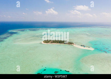 Onok Island Balabac, Philippines. The island of white sand on a large atoll, view from above. Tropical island with palm trees. Seascape with a paradise island. Stock Photo