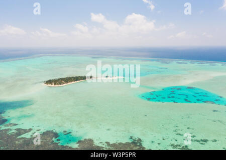 Onok Island Balabac, Philippines. The island of white sand on a large atoll, view from above. Tropical island with palm trees. Seascape with a paradise island. Stock Photo