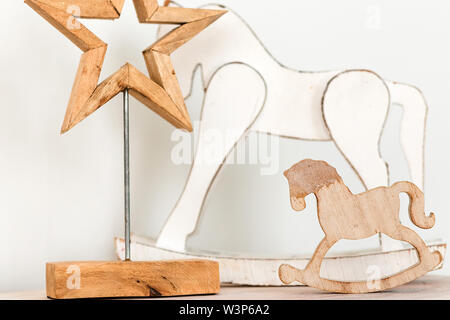 photo of there is a wooden horse and a star on the table Stock Photo