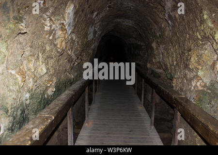 Visitors boardwalk in the ancient underground water supply tunnel at the excavated city Tel Meggido Israel. Otherwise known as Armageddon Stock Photo