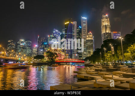 Singapore River and skyline at Raffles Place at night Stock Photo