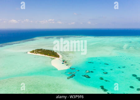 Tropical island surrounded by beautiful lagoons. Onok Island Balabac, Philippines. Rest on a tropical island. Nature of the Philippine Islands. Stock Photo