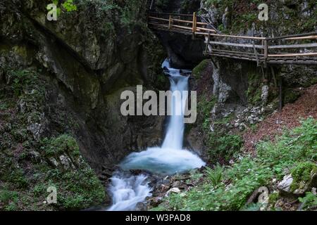 Wooden footbridge over waterfall in the Dr. Vogelgesang gorge at Trattenbach, Spital am Pyhrn, Upper Austria, Austria Stock Photo