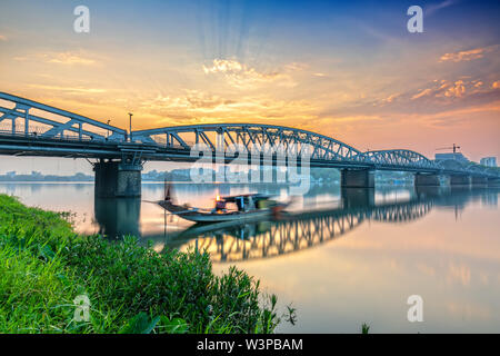 Dawn at Trang Tien Bridge. This a Gothic architectural bridge spanning the Perfume river from 18th century designed by Gustave Eiffel in Hue, Vietnam Stock Photo