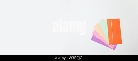Different colored envelopes on a gray monochrome background. Hello spring Stock Photo
