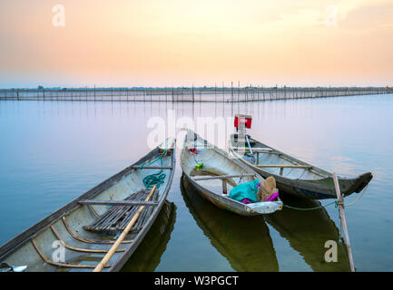 Wooden boat dock in Chuon lagoon, Hue, Vietnam. This is a living means of transportation in the flooded area in central Vietnam Stock Photo