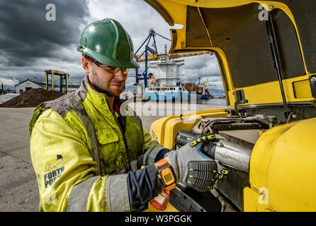 Skilled workers using power tools Stock Photo