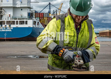 Skilled workers using power tools Stock Photo