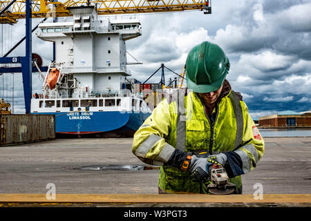 Skilled workers using power tools Stock Photo