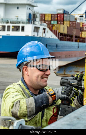 Skilled workers using power tools Stock Photo