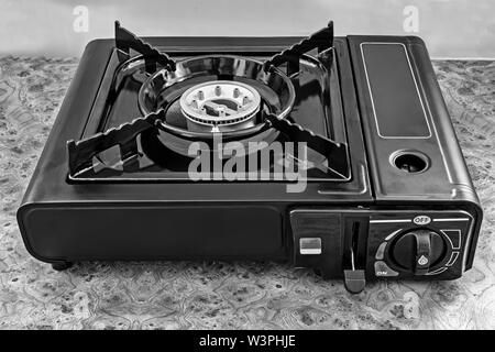 Small 1200w portable gas camping stove isolated on a white background Stock  Photo - Alamy