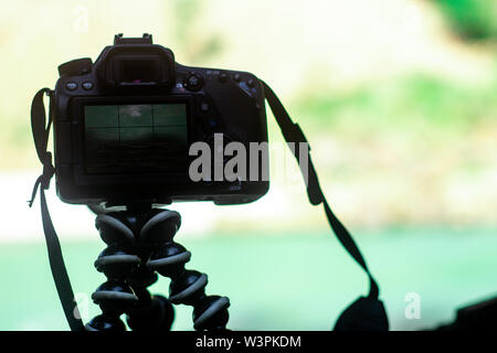camera on a gorilla pod taking pictures of a landscape Stock Photo