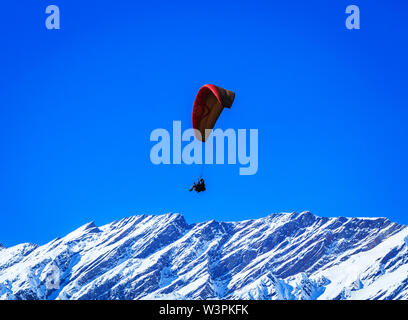 Paragliding in Solang valley near Manali in HImachal Pradesh India - Image Stock Photo