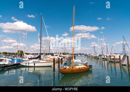 Konstanz, BW / Germany - 14. July 2019: wooden sailboat preparing to enter a berth in Konstanz harbor and docking Stock Photo