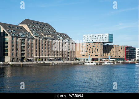 24.06.2019, Berlin, Germany, Europe - View of The Spreespeicher and the Hotel nhow on the banks of the Spree River in Friedrichshain-Kreuzberg. Stock Photo