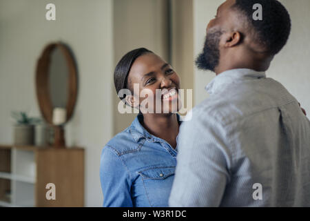 Young African American woman laughing with her husband at home Stock Photo