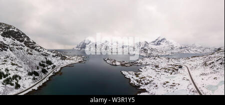 Aerial drone panoramic view of amazing Lofoten Islands winter scenery with famous Reine fishing village Norway, Scandinavia. Top view picture at sunse