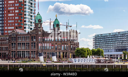 Rotterdam, Netherlands. July 2nd, 2019. Holland New York hotel restaurant at river Maas near the harbor. High buildings on the background Stock Photo