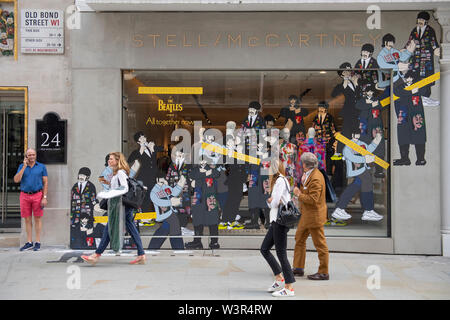 Stella McCartney shop, Old Bond Street, London, UK. 17th July 2019. Stella McCartney shop window promotes clothing range ‘All Together Now’ inspired by the psychedelic Beatles film ‘Yellow Submarine’. Credit: Malcolm Park/Alamy Live News. Stock Photo