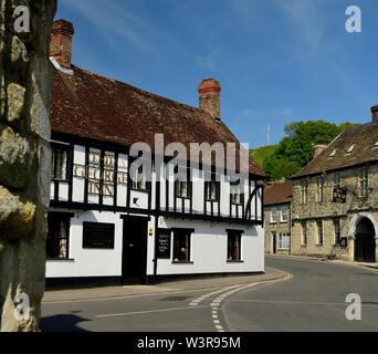 The George Inn at Mere, with the Old Ship Inn on the right, and Castle Hill in the background. Stock Photo