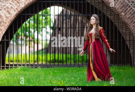 Woman in a red Renaissance dress Stock Photo