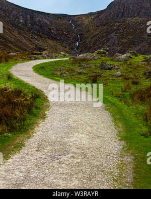 Path winding through a boulder strewn valley leading to Mahon Falls in Waterford County, Ireland Stock Photo