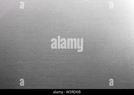 Close up industrial background of fractally scratched direct horizontal lines to silver metal/stainless steel surface. Creative detail macro photograp Stock Photo